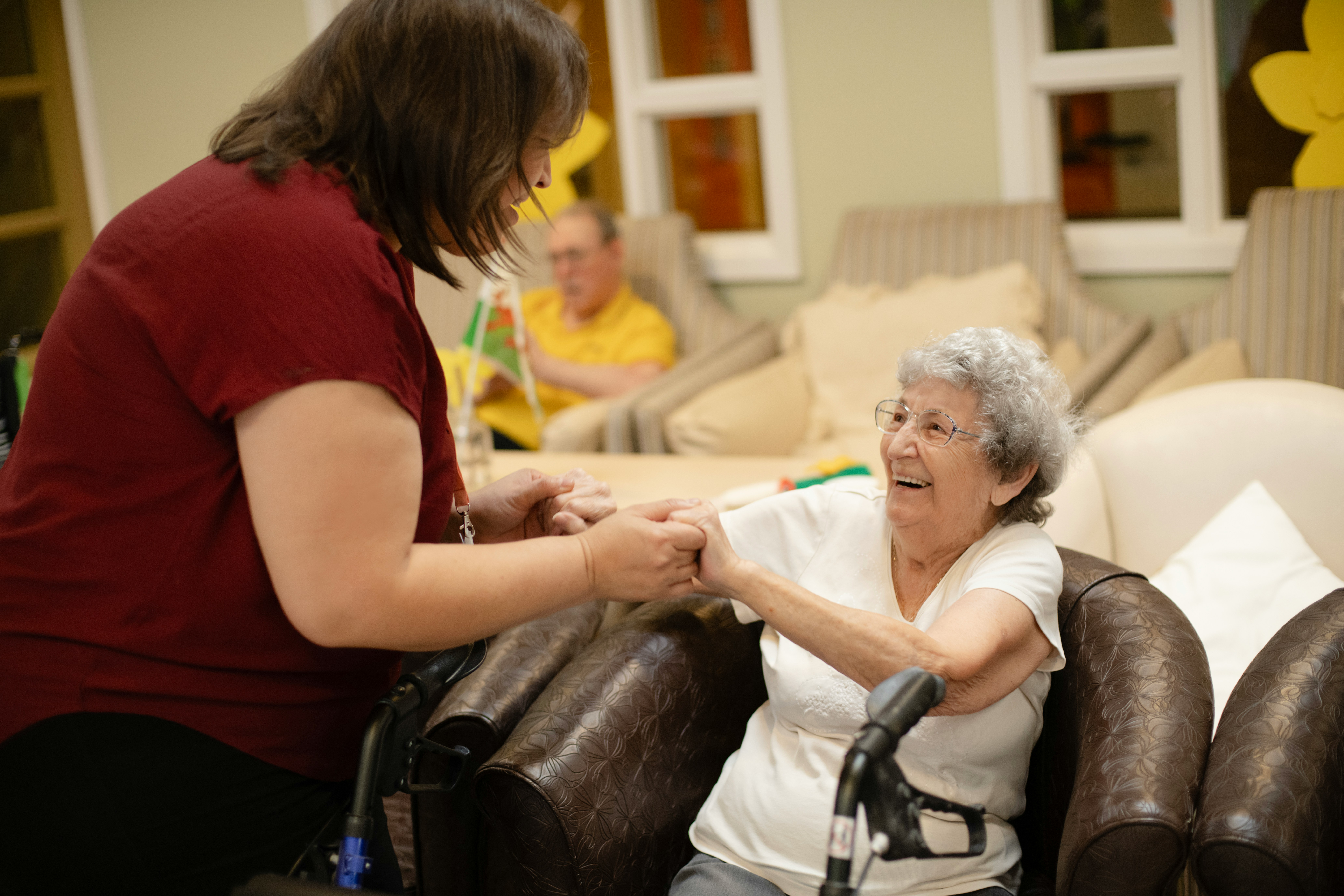 SafeRise Care professional supporting an elderly individual at home