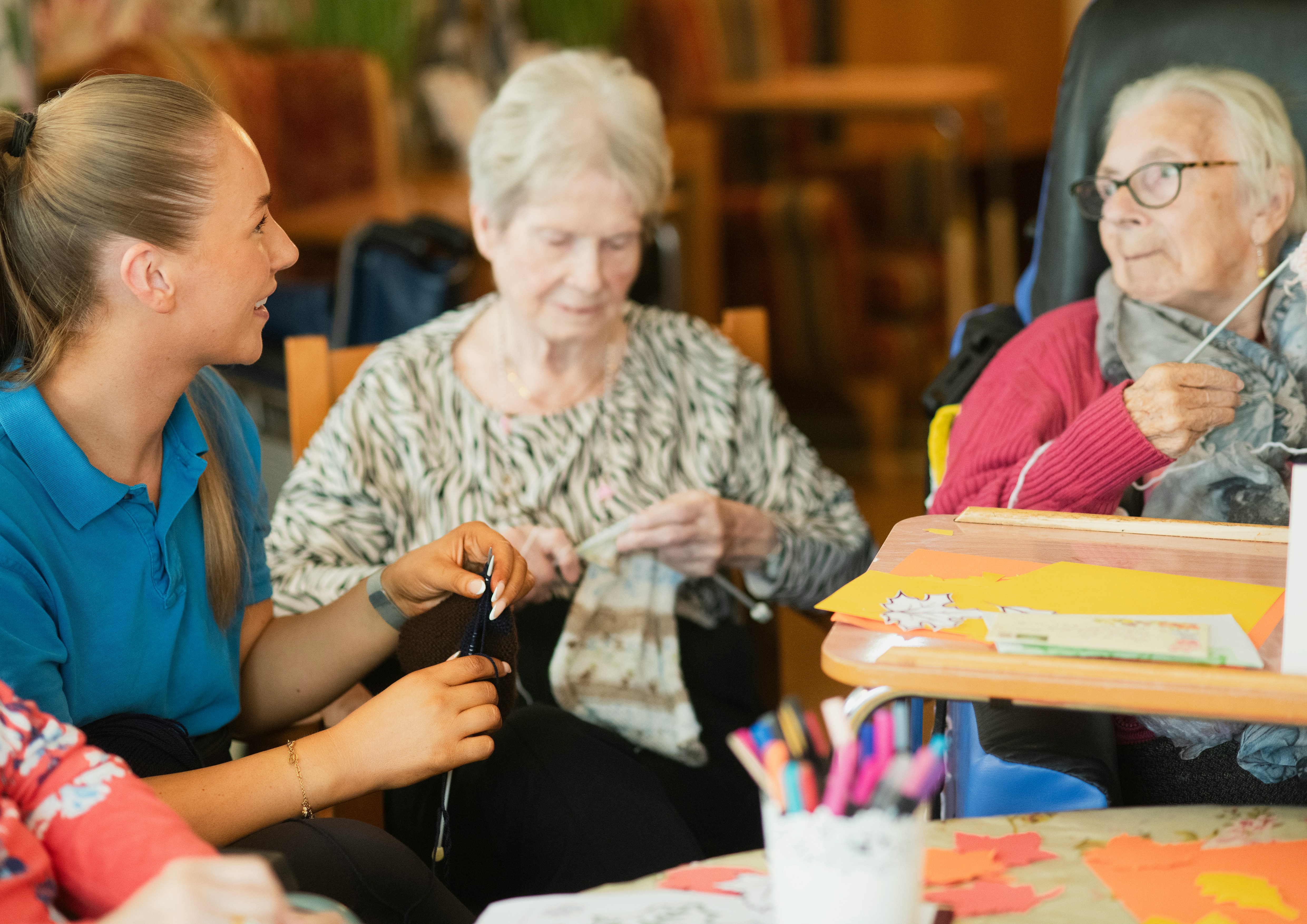 Caregiver helping senior manage daily kitchen tasks and nutrition